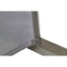 Metallic surface with a corner and a latch on a white background

