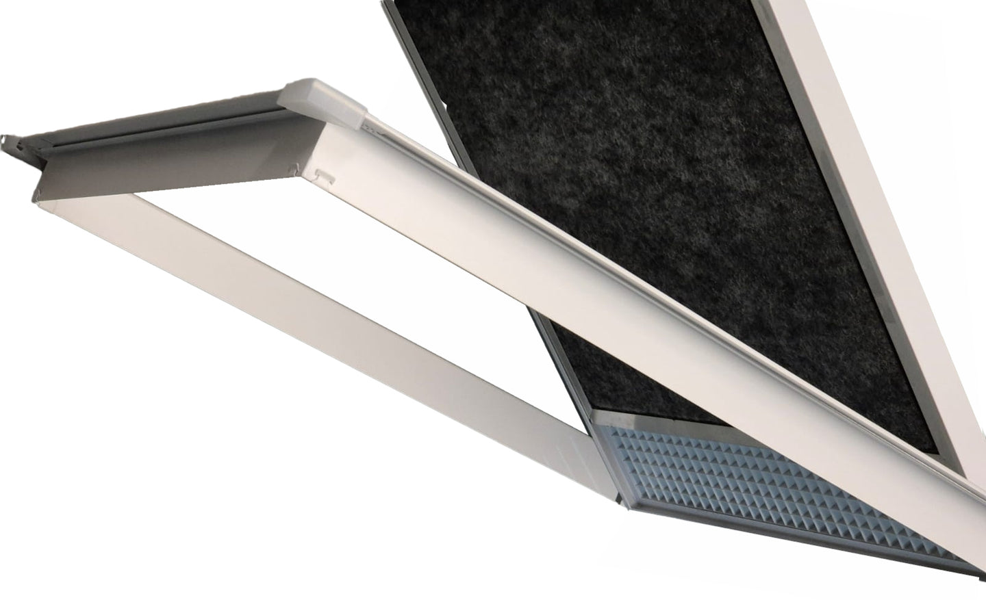A close-up of a modern linear LED light fixture with a white frame, showing the illuminated diffuser panel and the textured black filter mesh behind it.

